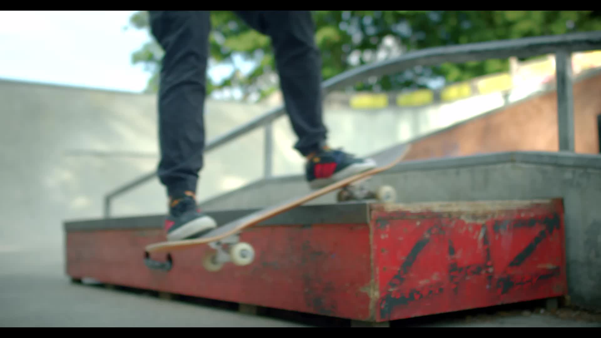 Extracted still image from stock video of a skater performing a backside boardslide - 16x9, no effects